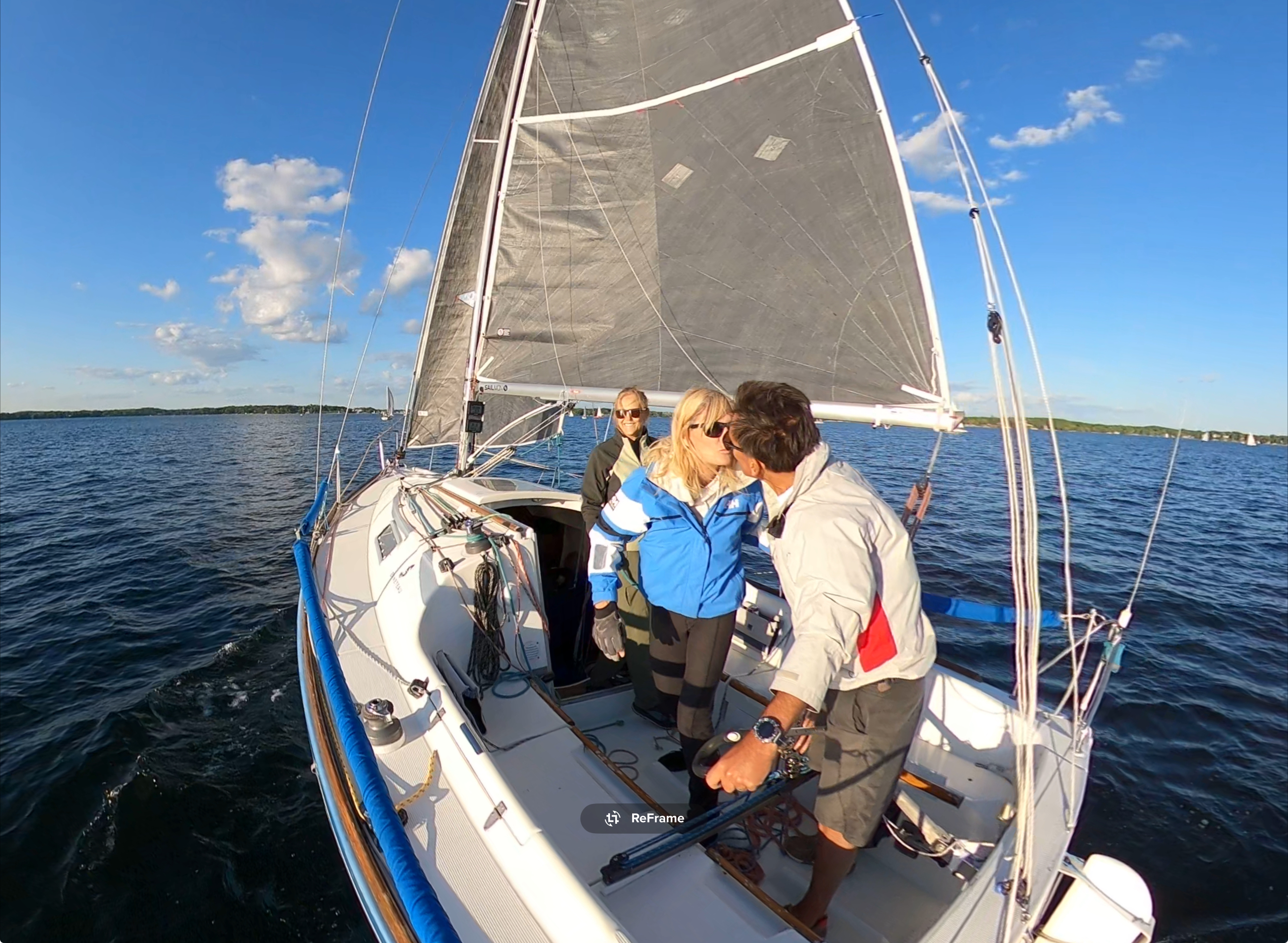 Charter guests enjoying sailing on BlueJ on Lake Minnetonka