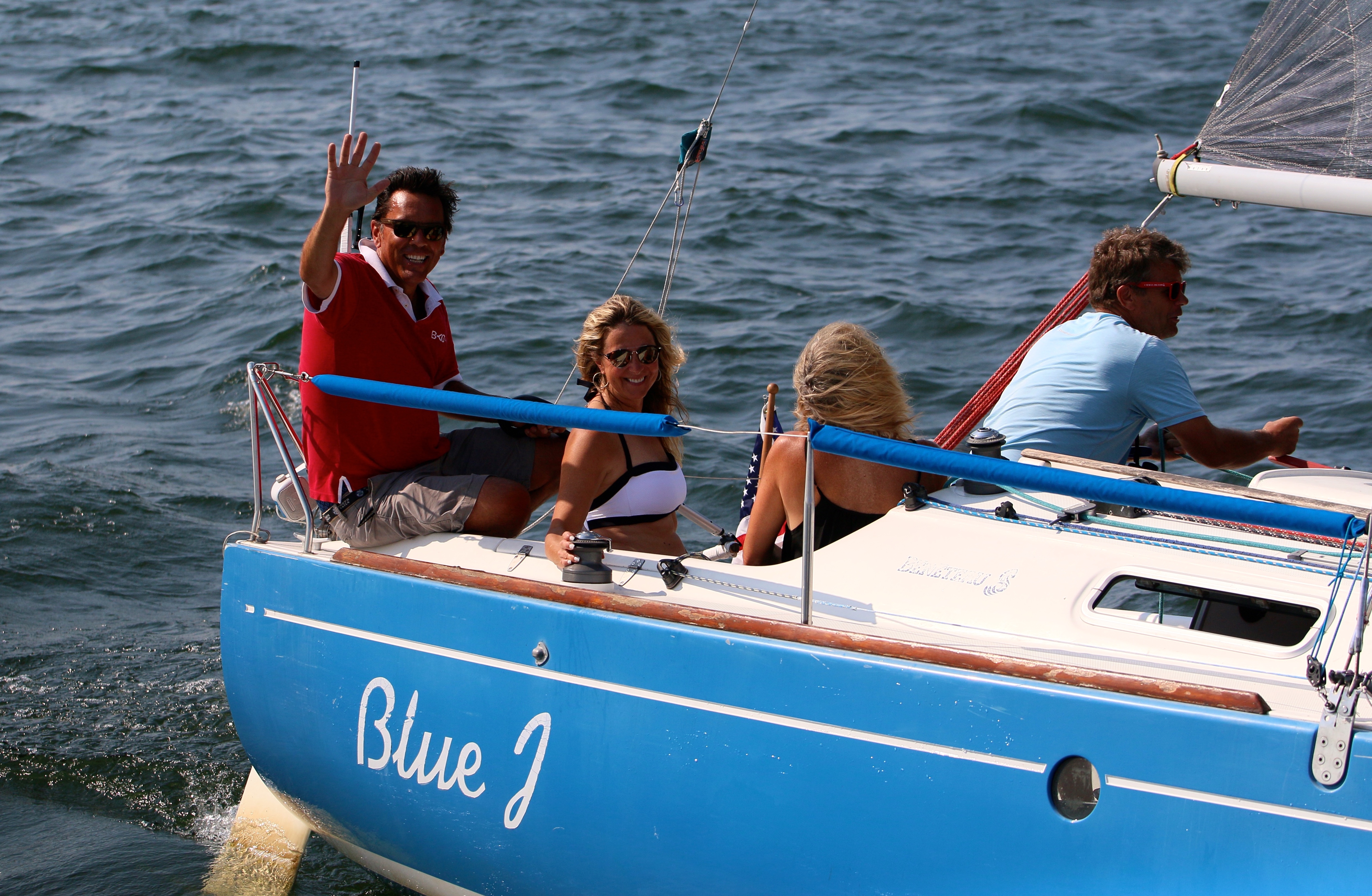 Close-up sailing detail of BlueJ charter boat with rigging and sails